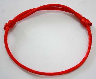 According to the Kabbalistic tradition, by tying a red string around 