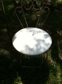   vintage hollywood regency table chair at an estate sale outside of