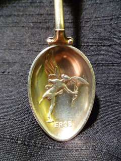 London Sterling spoon with Enameled Coat of Arms & Eros in Relief 