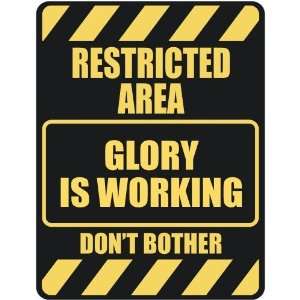   RESTRICTED AREA GLORY IS WORKING  PARKING SIGN