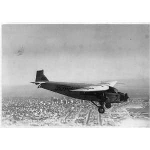 ,Ford Trimotor plane in flight over unknown city,1927,Airplane,Ford 