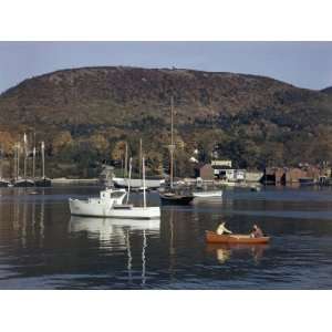 com Boaters Row Past Fishing Boats and Schooners in the Penobscot Bay 