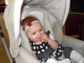 Below Baby Emilie aged 6 months wearing her yellow butterfly headband 