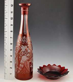 The wine bottle has a lovely traditional design with monkeys, birds 