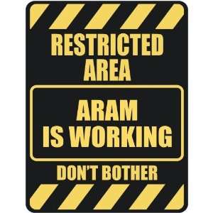   RESTRICTED AREA ARAM IS WORKING  PARKING SIGN