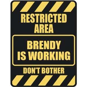   RESTRICTED AREA BRENDY IS WORKING  PARKING SIGN