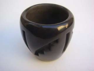 This is an original pottery bowl by Grace Medicine Flower. The piece 