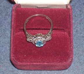 Blue Topaz Ring 10k gold band 2 smaller diamonds on each side  