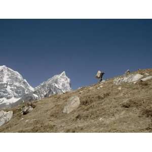  A Porter Carrying a Full Load in the Everest Region of 