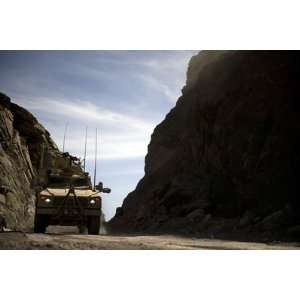  A Mrap Vehicle Drives Through the Mountains of Afghanistan 