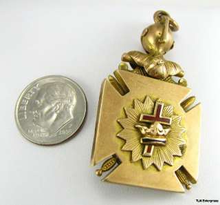   masonic fob features a knights of malta emblem on one side with