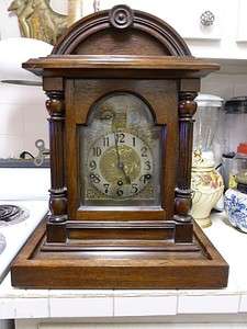   GERMAN WESTMINSTER CHIME CLOCK W KEY OPEN SIDE & WOOD STAND WORKS FINE