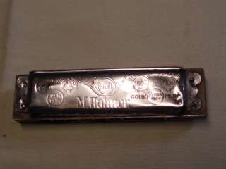   its been fixed with duct tape. Measures of the harmonica 10 cm long