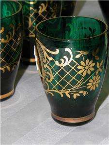 We are pleased to be offering this elegant liquor set in green glass 