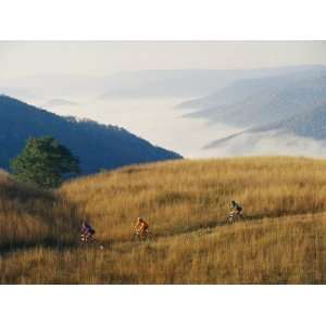 Mountain Bikers on Trail Above Fog Covered Elk River 