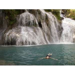  A Woman Floats in a Cool Pool of Water in the Grand Canyon 